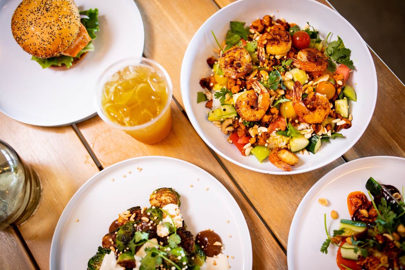 Group shot of McFlamingo bowls, sandwich, and small plates