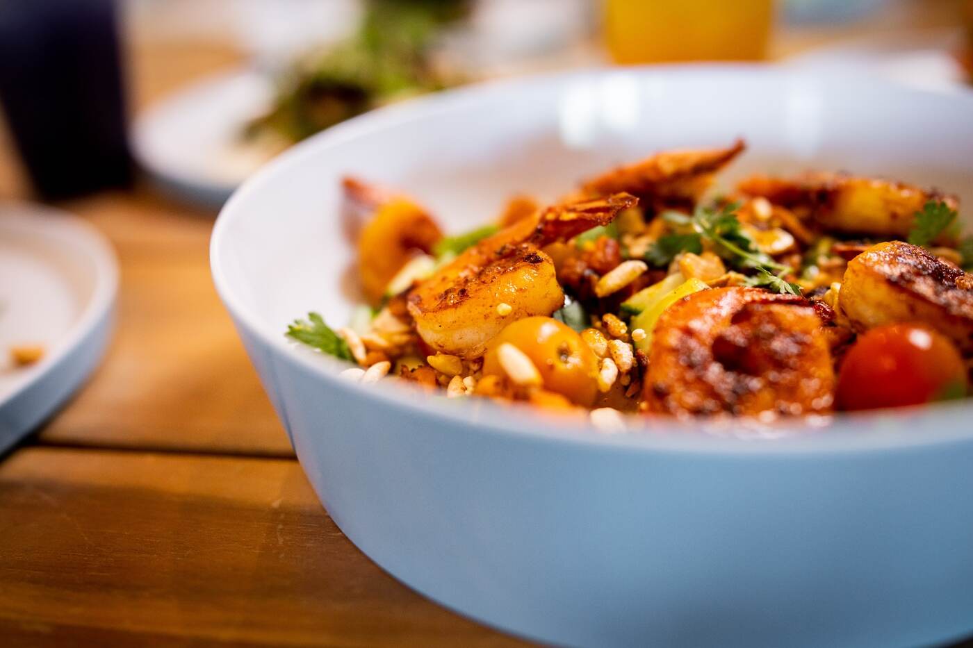Close-up of chili shrimp with cashews and tomatoes at McFlamingo