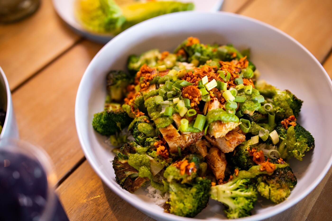 Grilled chicken and broccoli bowl with herb sauce at McFlamingo