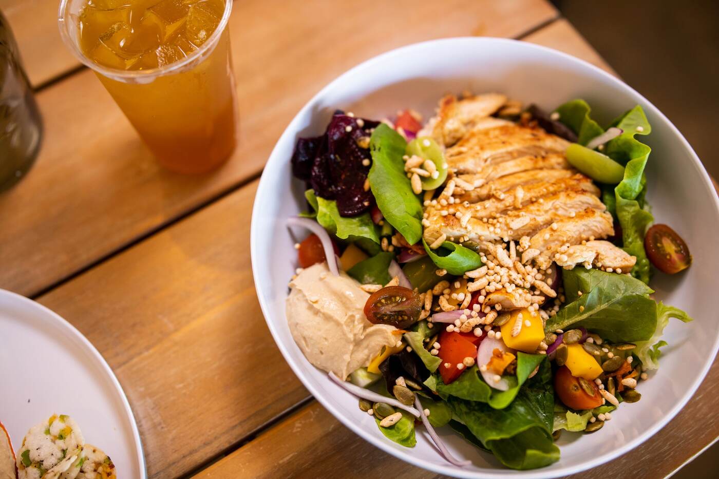 Chicken hummus salad bowl with mango and beets at McFlamingo