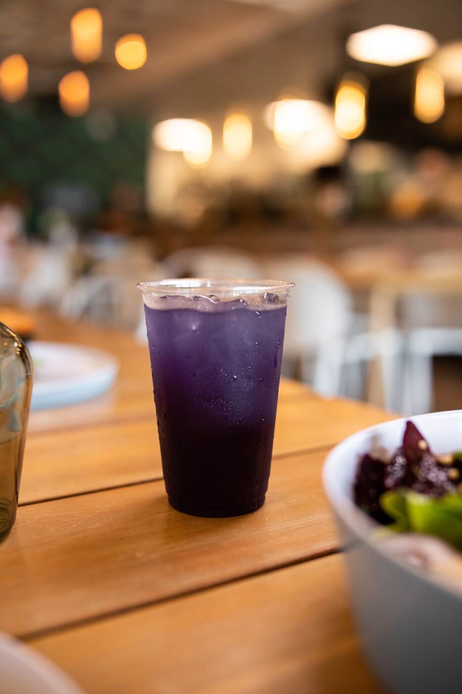 Tall purple iced cooler in a plastic cup at McFlamingo